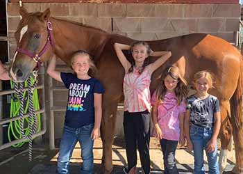Dal Porto Saddle Club students with horse in April 2023